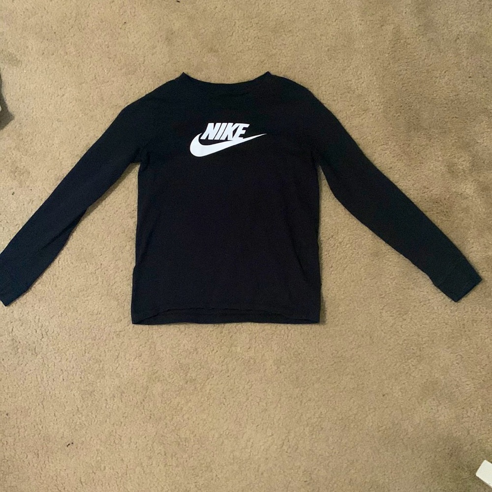 Long sleeve all black shirt , with the word “Nike” on the front in white
